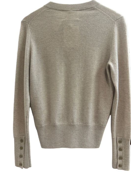 Sand Cashmere sweater on a white surface