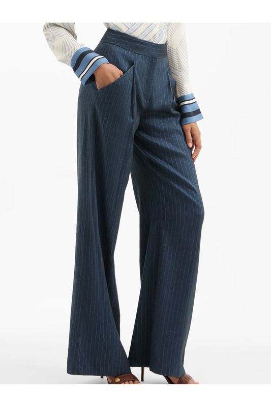 Person wearing blue striped pants and a white shirt on a white background