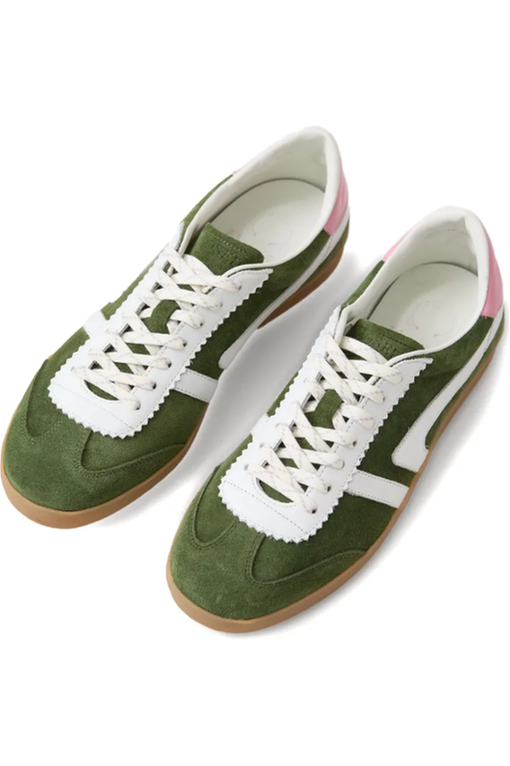 Green sneakers with white laces on a white background