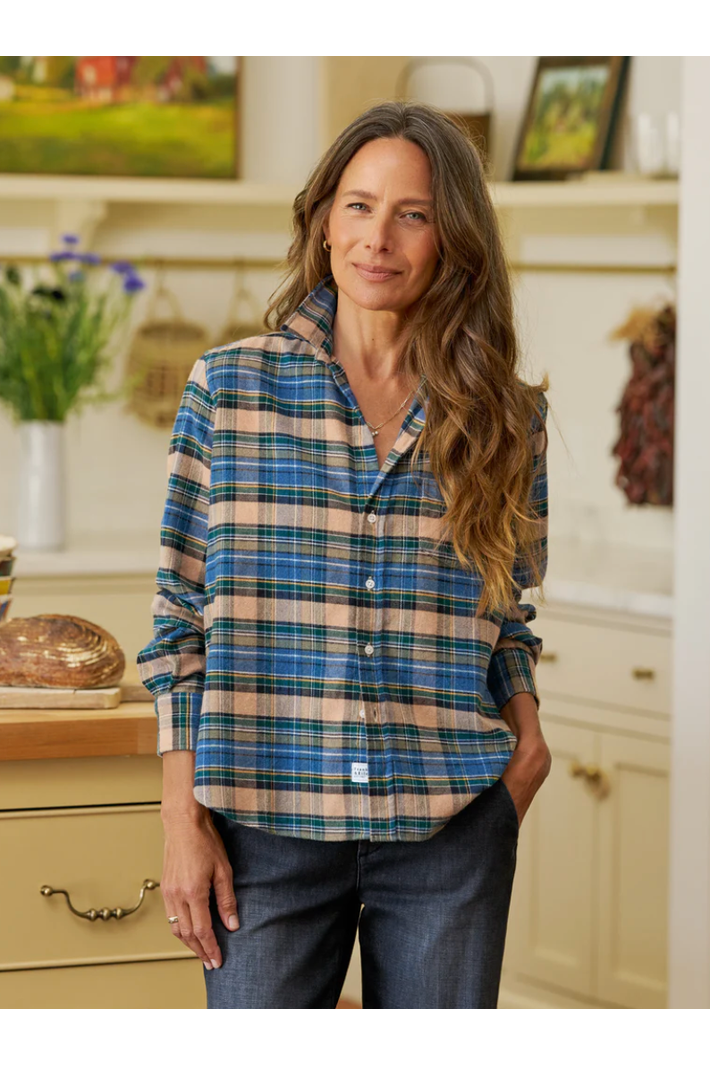 Woman wearing a plaid shirt in a kitchen setting