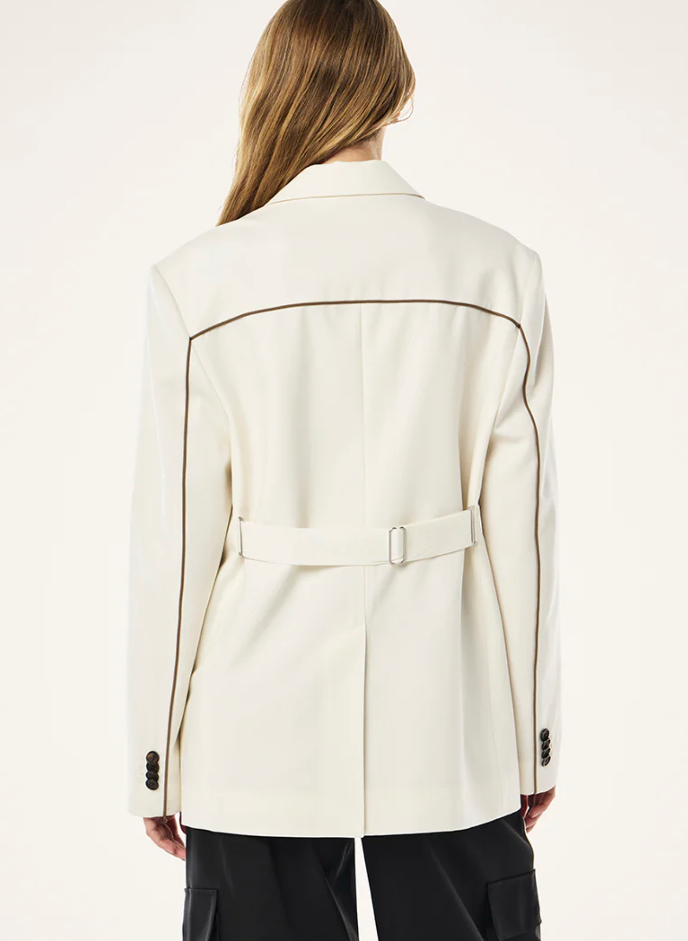 White coat with black accents worn by a person on a white background