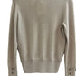 Sand Cashmere sweater on a white surface
