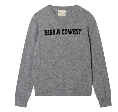 Gray sweater with 'Kiss a Cowboy' text on a white background