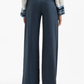 Navy pinstripe pants worn by a person on a white background