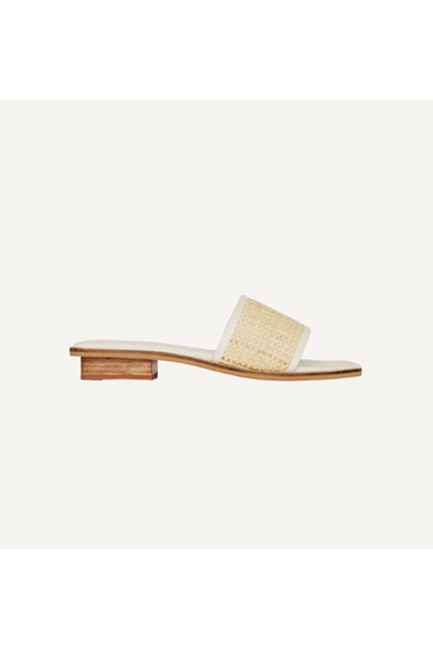 Expertly crafted for a sophisticated summer look, these handwoven leather sandals feature a stylish raffia strap and a comfortable padded insole. Perfect for all-day wear, the petite stacked heel adds a touch of height to your casual summer uniform. Leave your "nice" shoes on for long outings without sacrificing comfort.  Color | Cream Raffia Handwoven Rattan Heel Height: 2 cm Handmade in India