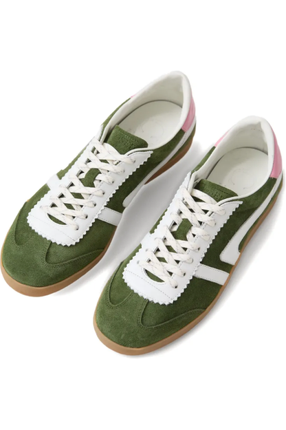 Green sneakers with white laces on a white background