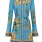 Blue floral and geometric patterned dress on a white background