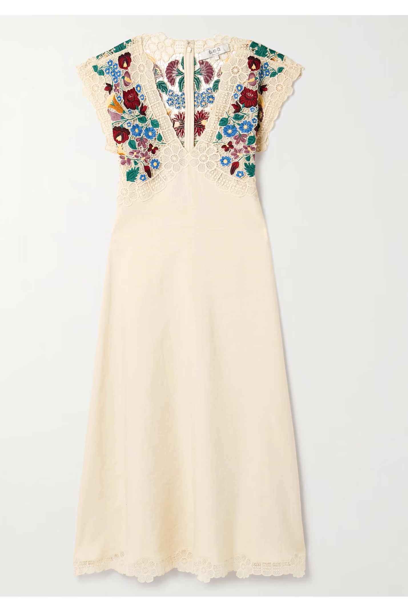 Cream-colored dress with floral lace details on a white background