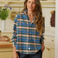 Woman wearing a plaid shirt in a kitchen setting