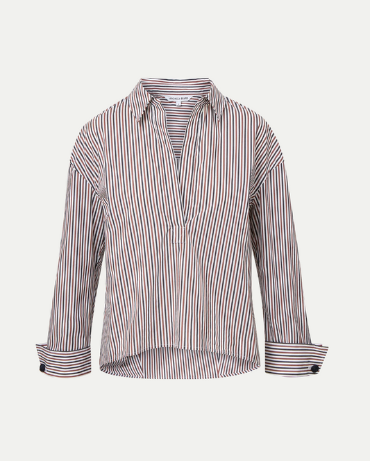 Striped shirt with rolled-up sleeves on a light gray background