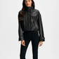 Woman wearing a black leather jacket on a white background