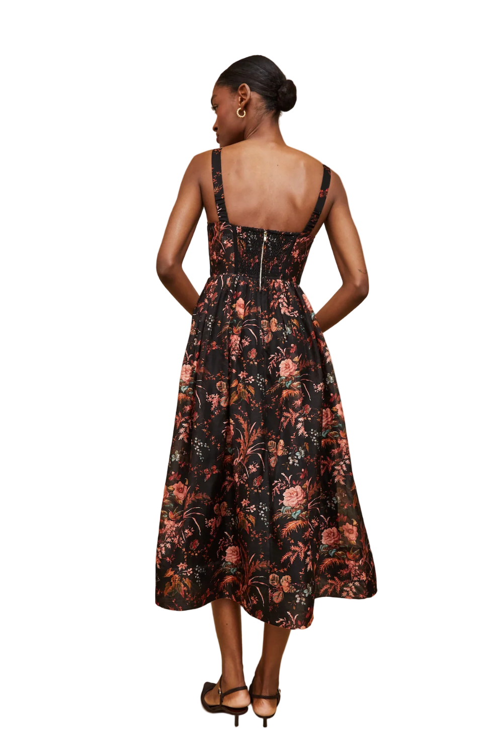Woman wearing a floral dress on a beige background