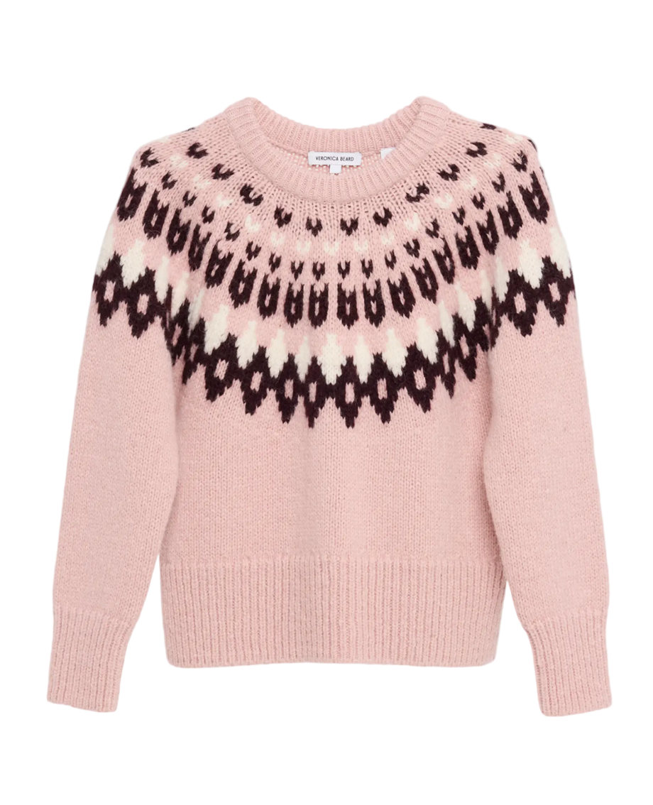 Pink sweater with black pattern on a light gray background