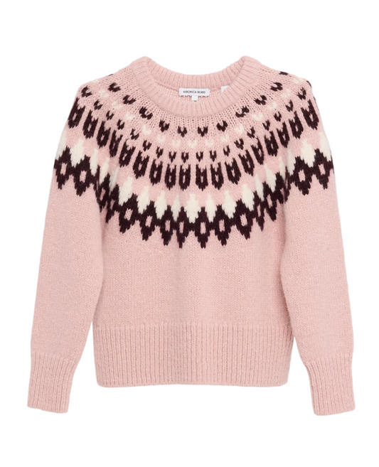 Pink sweater with black pattern on a light gray background