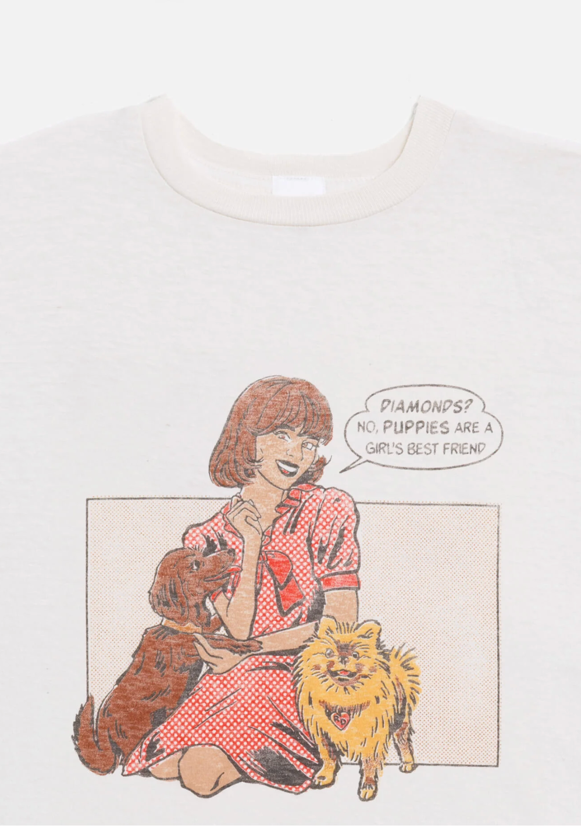 T-shirt with a graphic of a woman sitting with two cats and a speech bubble.