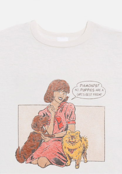 T-shirt with a graphic of a woman sitting with two cats and a speech bubble.