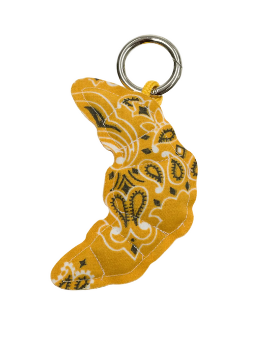 Yellow bandana pattern keychain on a light gray background