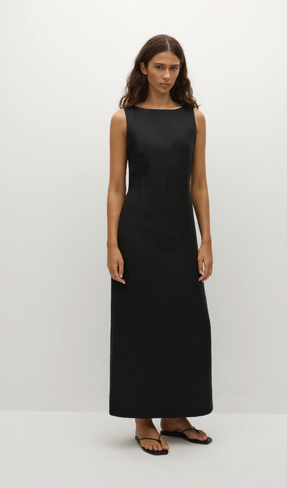 Woman wearing a black sleeveless dress on a white background