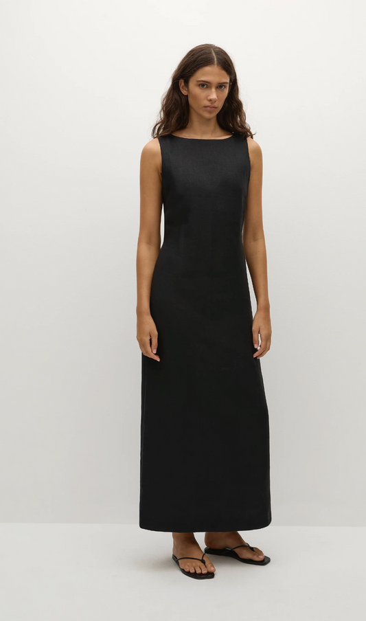 Woman wearing a black sleeveless dress on a white background