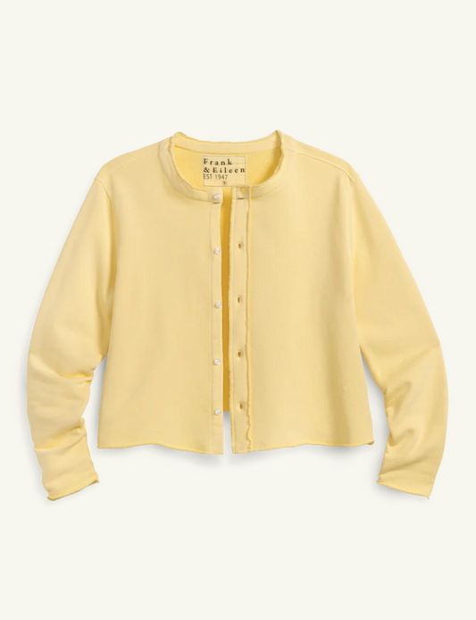 Light yellow cardigan on a white background