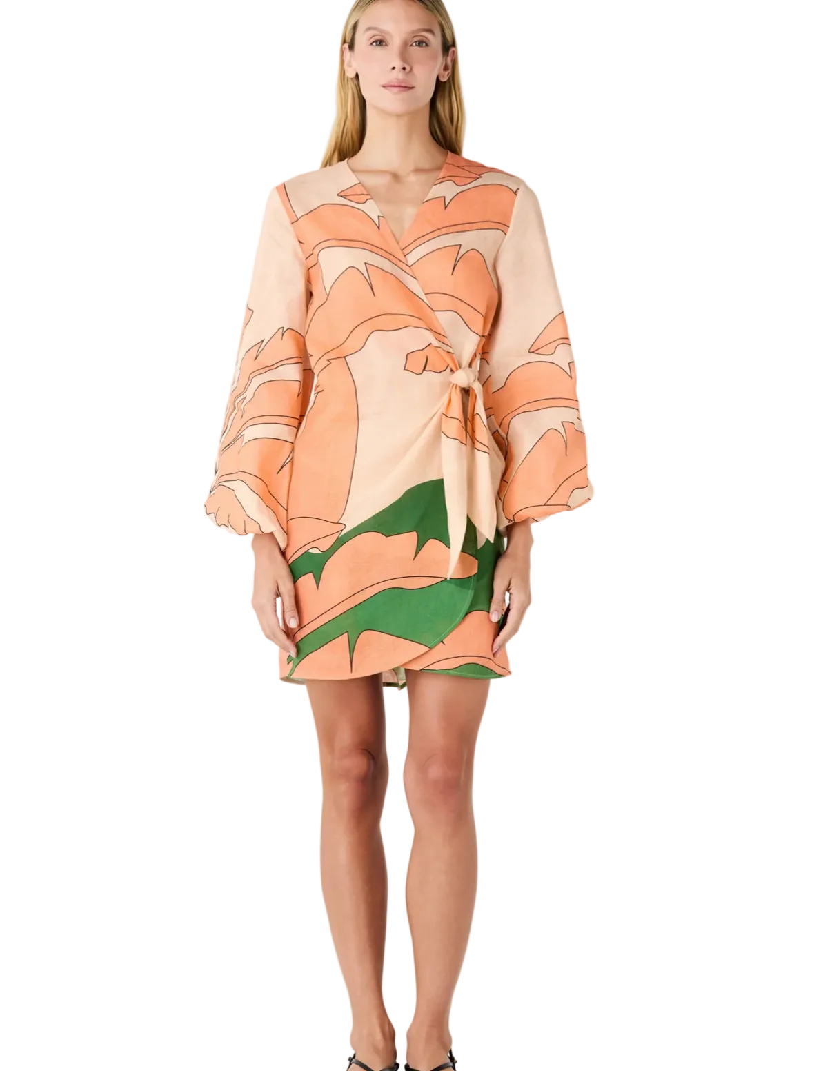 Woman wearing a patterned dress on a white background