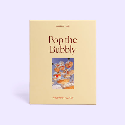 Piece Work Puzzles Pop the Bubbly puzzle box - available at Hiptique Woodland Hills California