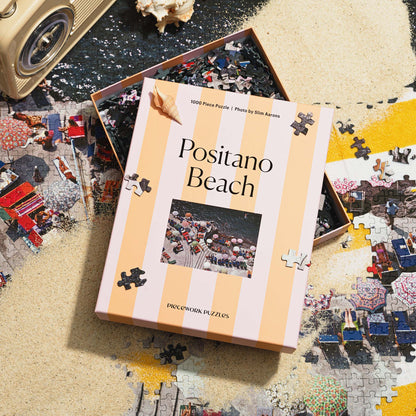 Piece Work Puzzles Positano Beach Slim Aarons 1000 piece puzzle available at Hiptique Woodland Hills California